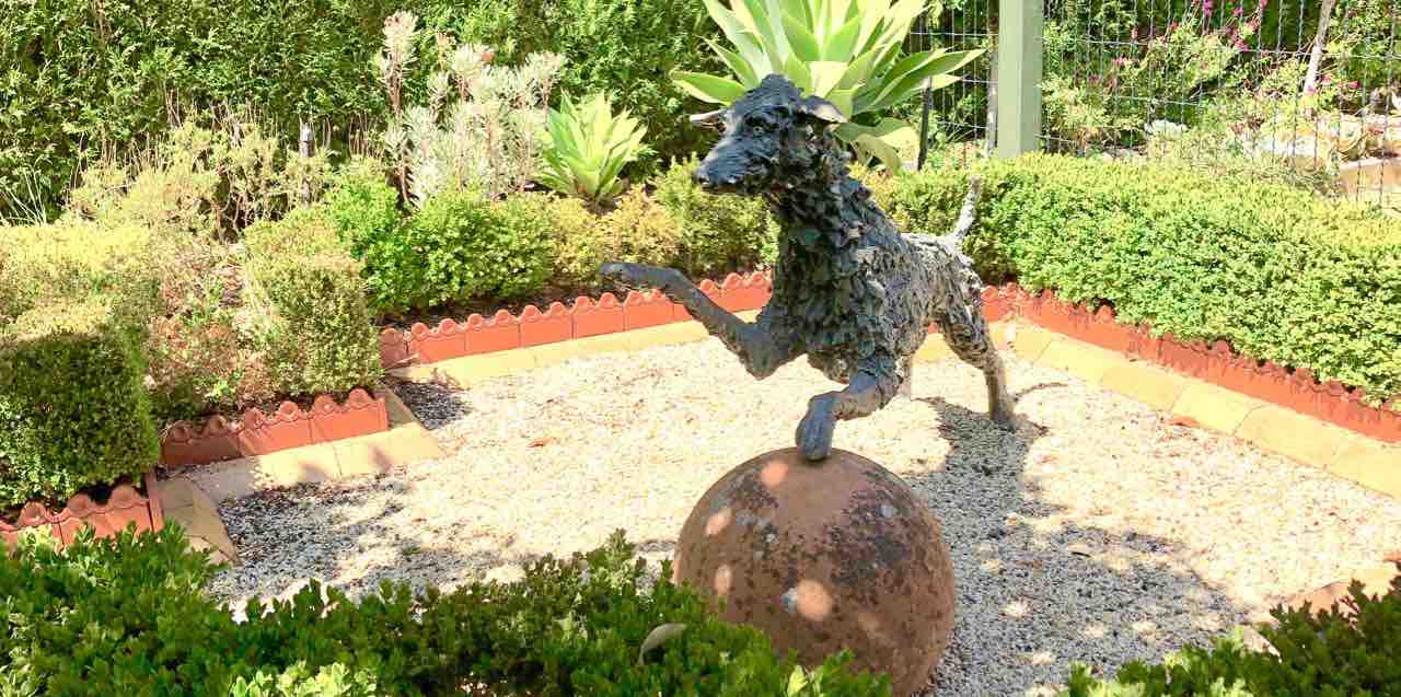 Sensory garden dog and ball sculpture